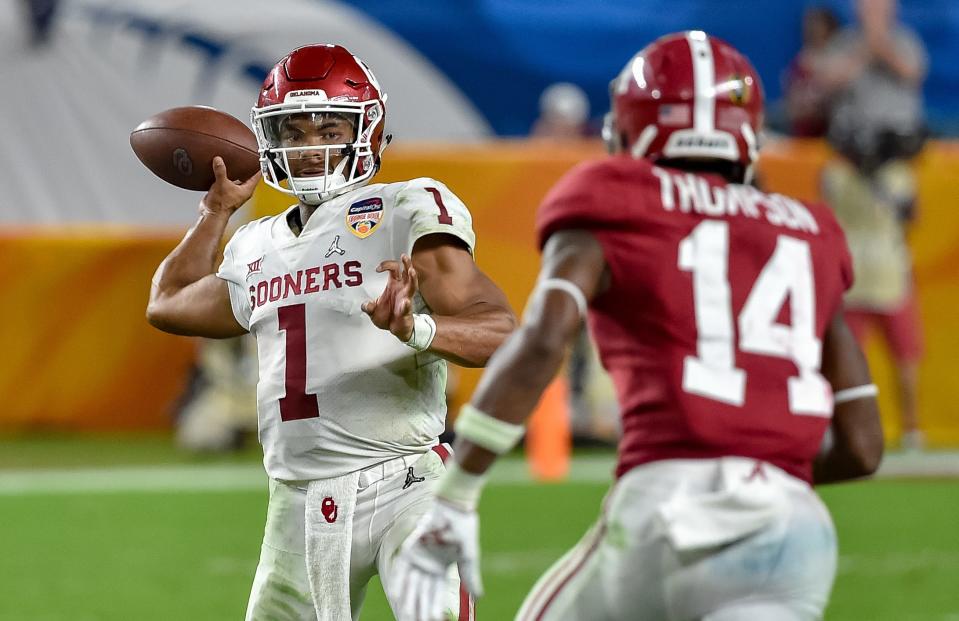 Oklahoma quarterback Kyler Murray (1) is pressured by Alabama defensive back Deionte Thompson (14) during the 2018 College Football Playoff semifinal game at the Orange Bowl at Hard Rock Stadium.