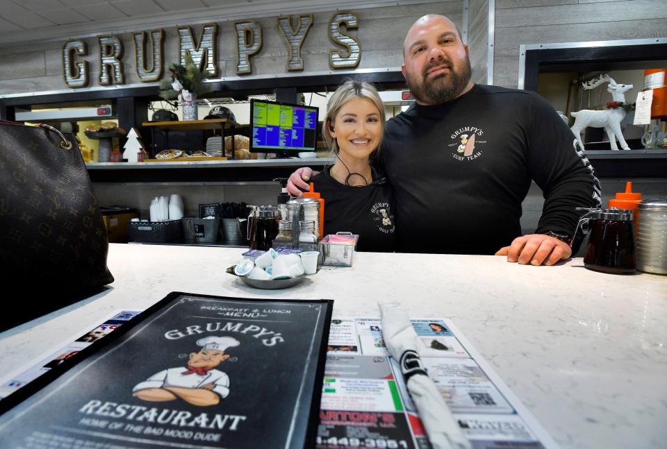 Daniel DeLeon, president and CEO of Grumpy's Restaurant and his wife, Morgan, are shown behind the counter of their Orange Park flagship diner on  Dec. 1. The husband-and-wife restaurateurs resurrected Grumpy's, which was on the brink of closing permanently in 1999, and turned it into a successful restaurant that is expanding throughout Northeast Florida.