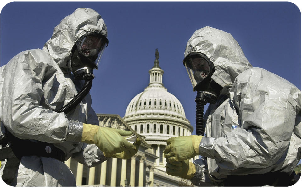 Members of the U.S. Marine Corps demonstrate anthrax cleanup techniques.