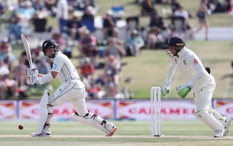New Zealands BJ Watling (L) plays a shot watched by Englands Jos Buttler (R) during the third day of the first Test cricket match between England and New Zealand at Bay Oval in Mount Maunganui on November 23, 2019 - Credit: AFP