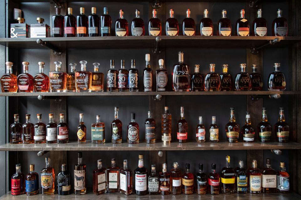 A wall of rare bourbons lines the wall where customers enter inside the new Doc's Bourbon Room space beside Doc Crow's Southern Smokehouse and Raw Bar on Main Street. Jan. 29, 2020