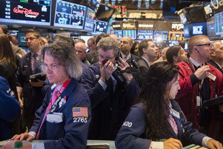 Traders work on the floor of the New York Stock Exchange shortly after the opening bell in New York April 4, 2014. REUTERS/Lucas Jackson