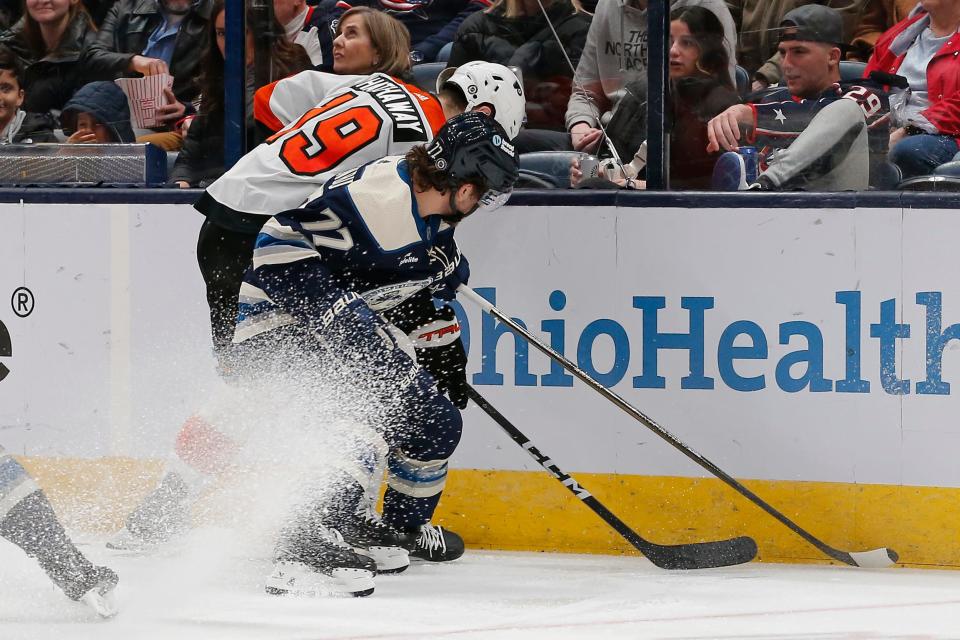 Apr 6, 2024; Columbus, Ohio, USA; Columbus Blue Jackets defenseman Nick Blankenburg (77) and Philadelphia Flyers right wing Garnet Hathaway (19) battle for the puck during the second period at Nationwide Arena. Mandatory Credit: Russell LaBounty-USA TODAY Sports