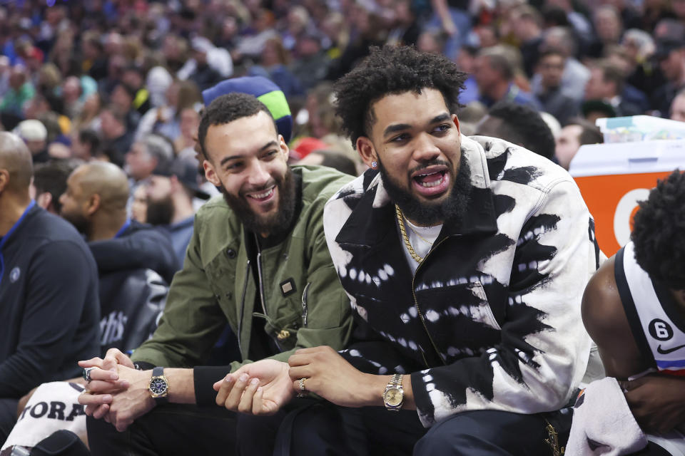 Minnesota Timberwolves center Rudy Gobert (left) and center Karl-Anthony Towns (right) react to a play by the Utah Jazz in the fourth quarter at Vivint Arena. Mandatory Credit: Rob Gray-USA TODAY Sports