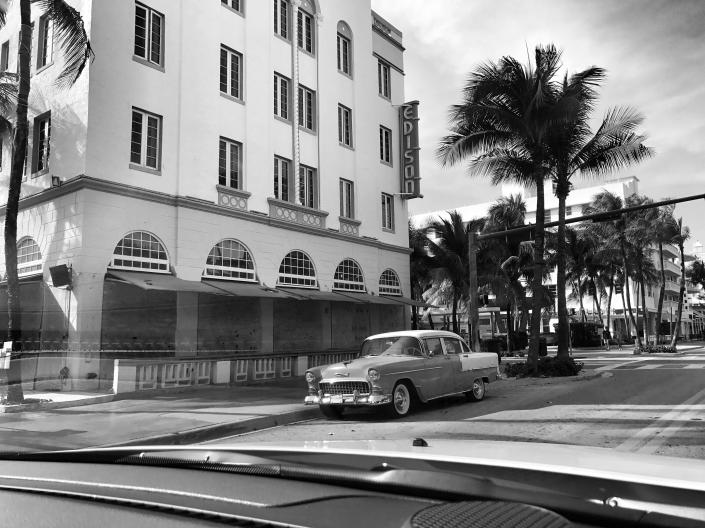 <p>A 1950s-era Chevy Bel Air sits parked in front o the boarded-up Edison Hotel in Miami Beach ahead of the expected arrival of Hurricane Irma. (Photo: Holly Bailey/Yahoo News) </p>