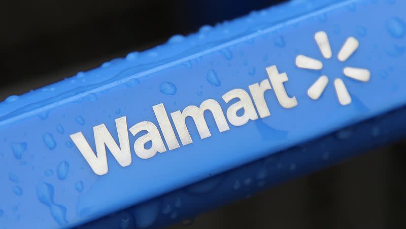 This 2011 file photo shows the rain-soaked handle of a shopping cart outside the Walmart store in Mayfield Heights, Ohio. Here comes the first of two Black Friday events at Walmart in 2023.