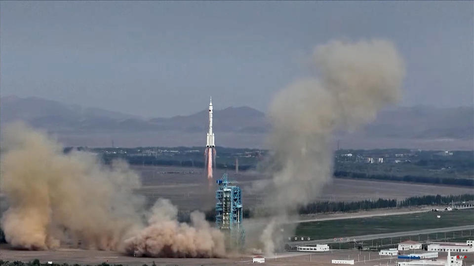 A Chinese Long March 2F rocket climbs away from the Jiuquan Satellite Launch Center in northwest China, carrying three taikonauts -- astronauts -- on a six-hour flight to the Tiangong space station. / Credit: CCTV