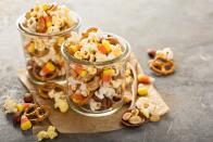 <p>All you have to do is combine everyone's favorite mini snacks (pretzels, popcorn, cereal, etc.) into a bag or container. It's also a great idea to take a bag or two with you while you trick-or-treat through the neighborhood. </p>