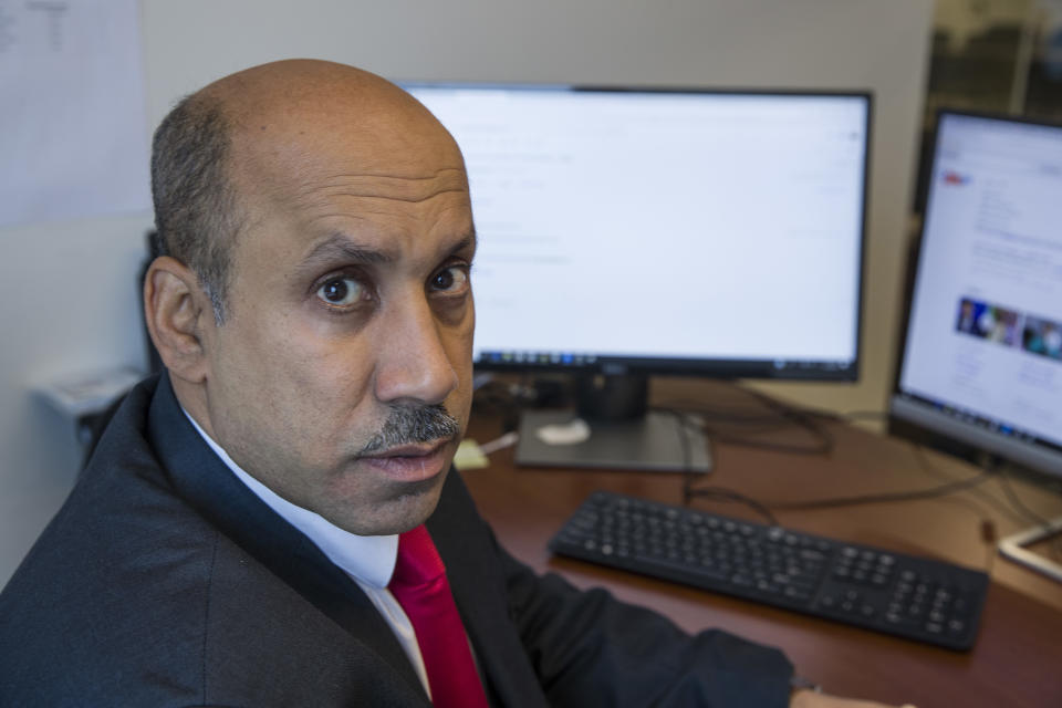 In this Oct. 26, 2018, photo Ali AlAhmed poses for a photograph in his office in Washington. Hackers are impersonating reporters in a bid to intercept the communications of the prominent Saudi opposition figure in Washington. An Associated Press review of malicious emails sent to AlAhmed shows he was approached by hackers masquerading as a BBC reporter and as Washington Post columnist Jamal Khashoggi, who was killed last month at the Saudi consulate in Istanbul. The emails were attempts to break into AlAhmed’s inbox. AlAhmed blames the Saudi government for the hacking campaign, although the AP has yet to find any forensic evidence to back that.(AP Photo/Alex Brandon)