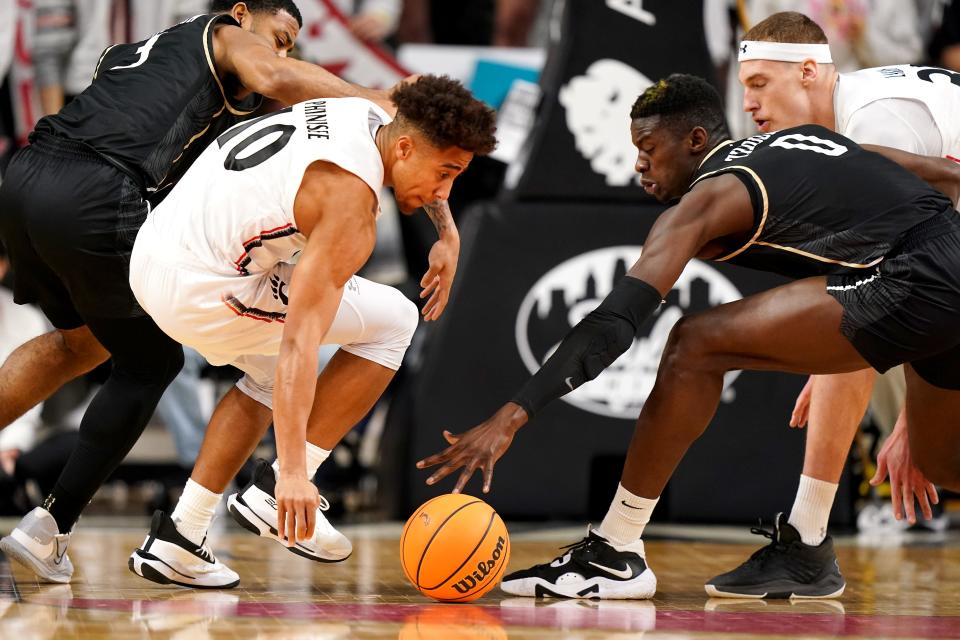 Cincinnati Bearcats guard Rob Phinisee (10) steals the ball from UCF Knights guard Darius Johnson (3) in the first half between the UCF Knights and the Cincinnati Bearcats, Saturday, Feb. 4