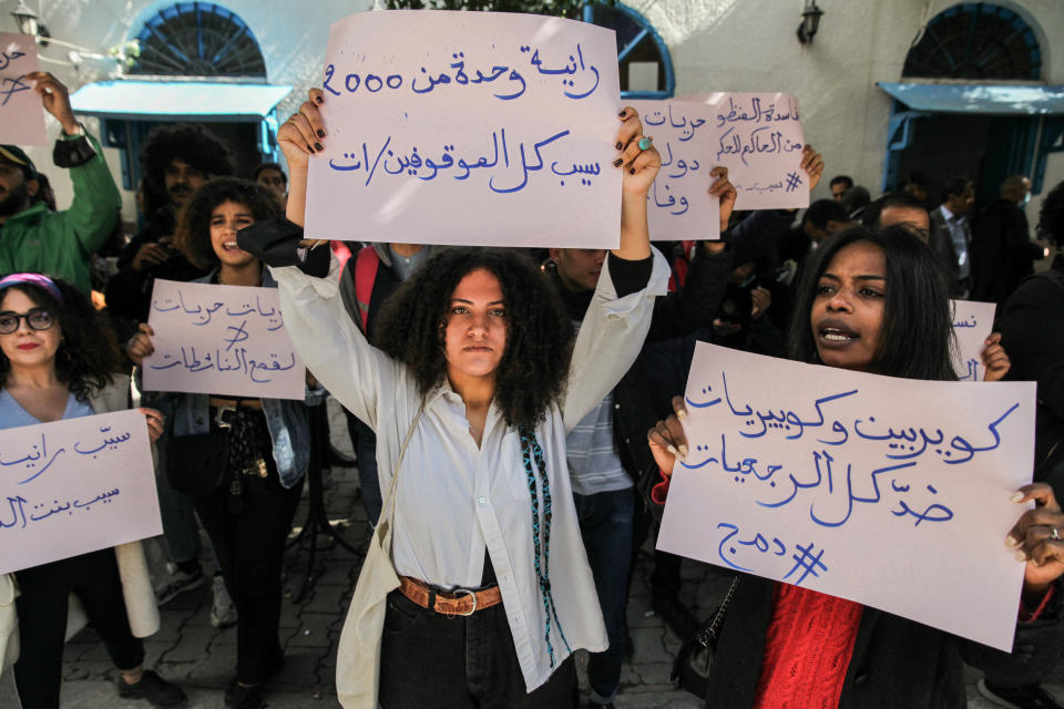 Protesters raise placards that read in Arabic, we queers are against all the retrograde Islamists, as others raise placards that read in Arabic, Release all young detainees, during a protest held on occasion of the appeal trial of the LGBTQI+ and feminist activist Rania Amdouni, outside the court of Tunis in Tunisia on March 17, 2021, to demand her release. 
Ten days ago, the queer Rania Amdouni, 26-year-old, has been arrested and incarcerated in a women's prison after being sentenced at first instance to six months in jail for insulting police and abuse of morals. (Photo by Chedly Ben Ibrahim/NurPhoto via Getty Images)