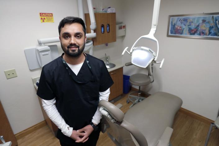 Mohammad Azimy is a dental assistant at Partnership Community Health Center. He is pictured here May 25 at the dental clinic in Grand Chute.