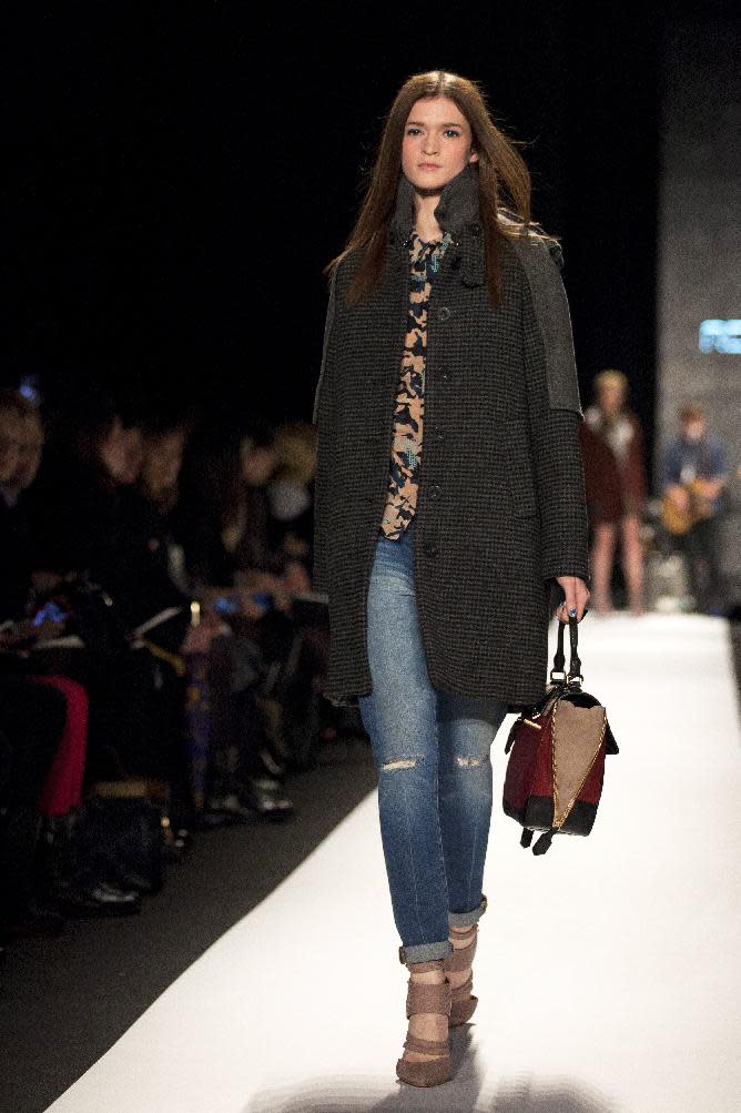 A model walks the runway during the Rebecca Minkoff Fall 2013 fashion show during Fashion Week, Friday, Feb. 8, 2013, in New York. (AP Photo/Karly Domb Sadof)