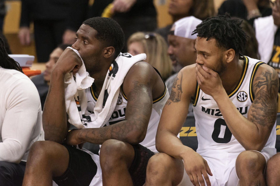 Missouri's Jeremiah Tilmon, left, and Torrence Watson, right, watch the second half of an NCAA college basketball game against Mississippi State from the bench Saturday, Feb. 29, 2020, in Columbia, Mo. Mississippi State won 67-63. (AP Photo/L.G. Patterson)