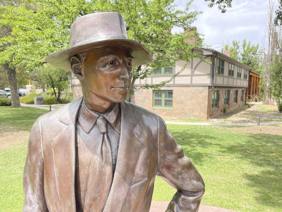 A bronze statue of physicist J. Robert Oppenheimer stands outside a historic building in Los Alamos, N.M., on Aug. 13, 2023. Los Alamos was the perfect spot for the U.S. government's top-secret Manhattan Project. Almost overnight, the remote location was transformed to accommodate thousands of scientists, soldiers and other workers who were racing to develop the world's first atomic bomb. The community is facing growing pains again, 80 years later, as it works to modernize the country's nuclear arsenal. (AP Photo/Susan Montoya Bryan)