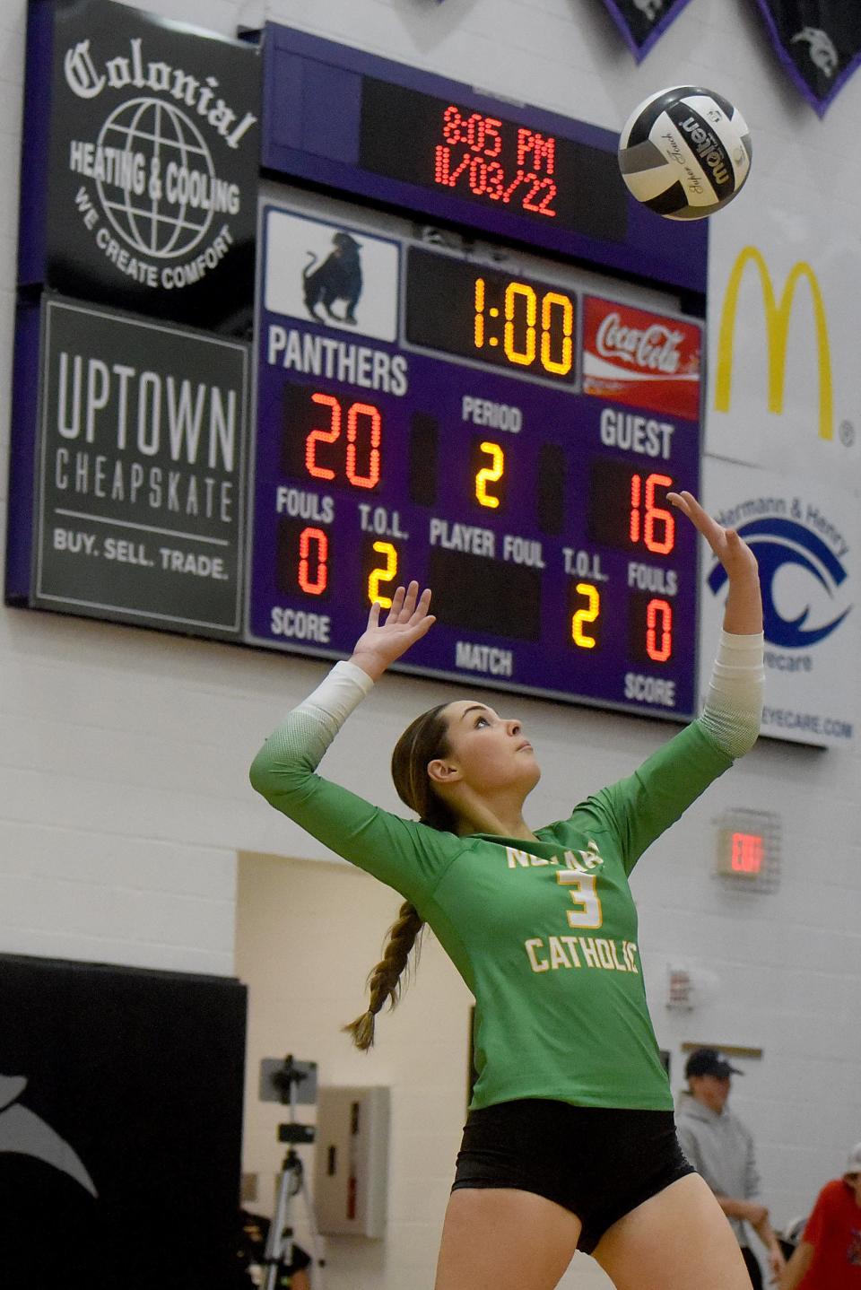 Newark Catholic junior Kami Diaz serves to Trimble during a Division IV regional semifinal on Thursday, Nov. 3, 2022 at Pickerington High School North. The Green Wave defeated the Tomcats in three straight sets.