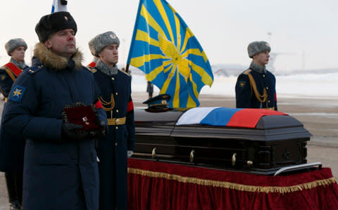 A memorial ceremony for Russian air force pilot Roman Filipov, who killed himself with a grenade after his aircraft was shot down over Syria this month - Credit: Vadim Savitsky/Handout via Reuters