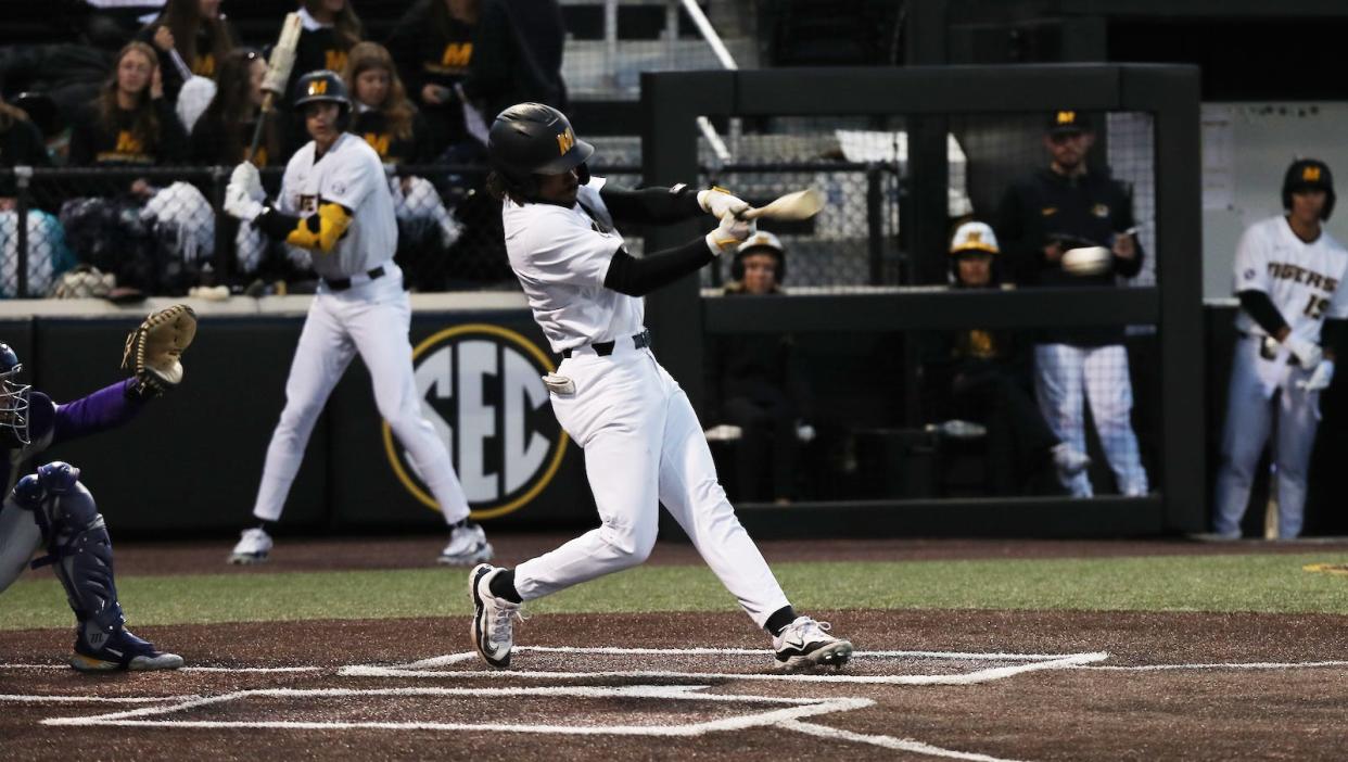 Missouri left fielder Jeric Curtis swings at a pitch during a game against LSU on Friday night at Taylor Stadium in Columbia.