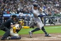 New York Yankees' Aaron Judge hits an RBI single during the sixth inning of a baseball game against the Milwaukee Brewers Sunday, April 28, 2024, in Milwaukee. (AP Photo/Morry Gash)