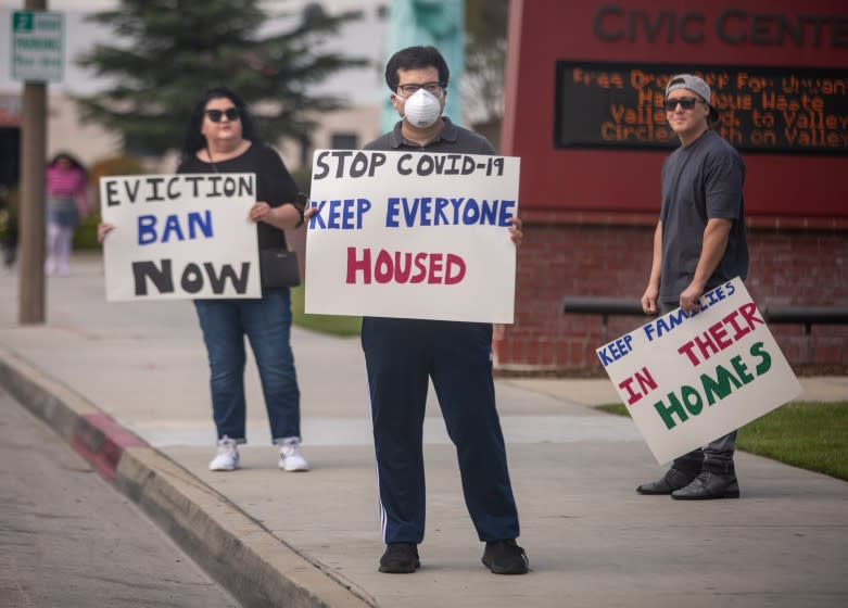 EL MONTE, CA - MARCH 29: Tenant rights activists assemble at the El Monte City Hall to demand that the El Monte City Council pass an eviction moratorium barring all evictions during the coronavirus pandemic on Sunday, March 29, 2020 in El Monte, CA. (Jason Armond / Los Angeles Times)