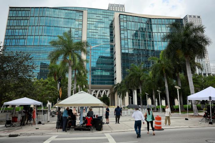 News crews camp out in front of a federal court building in Miami anticipating Donald Trump’s arrival after a federal indictment was unsealed on 9 June (Getty Images)
