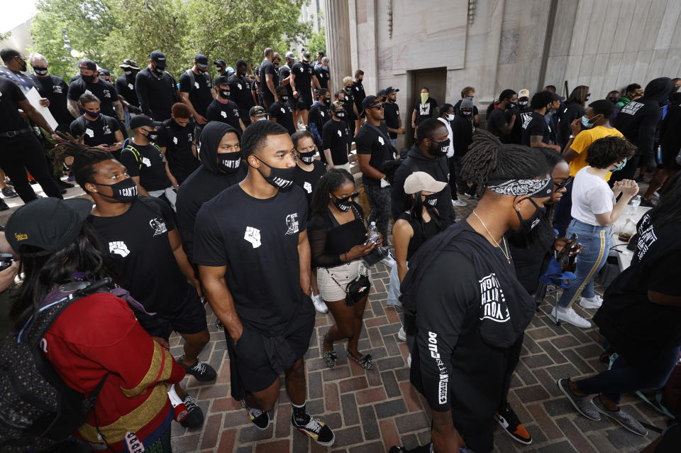 Denver Broncos take part in a rally in the Greek Amphitheatre in Civic Center Park over the death of George Floyd Saturday, June 6, 2020, in downtown Denver. (AP Photo/David Zalubowski)