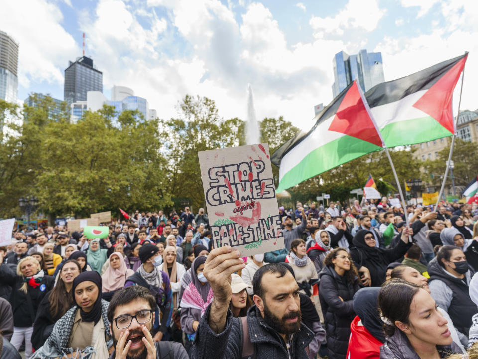 A pro-Palestinian rally under the slogan "Peace and Justice in the Middle East" takes place on Opernplatz, Frankfurt/Main, Saturday, Oct. 21, 2023. The Administrative Court of Frankfurt has lifted the ban on the anti-Israeli demonstration originally imposed by the city. (Andreas Arnold/dpa via AP)