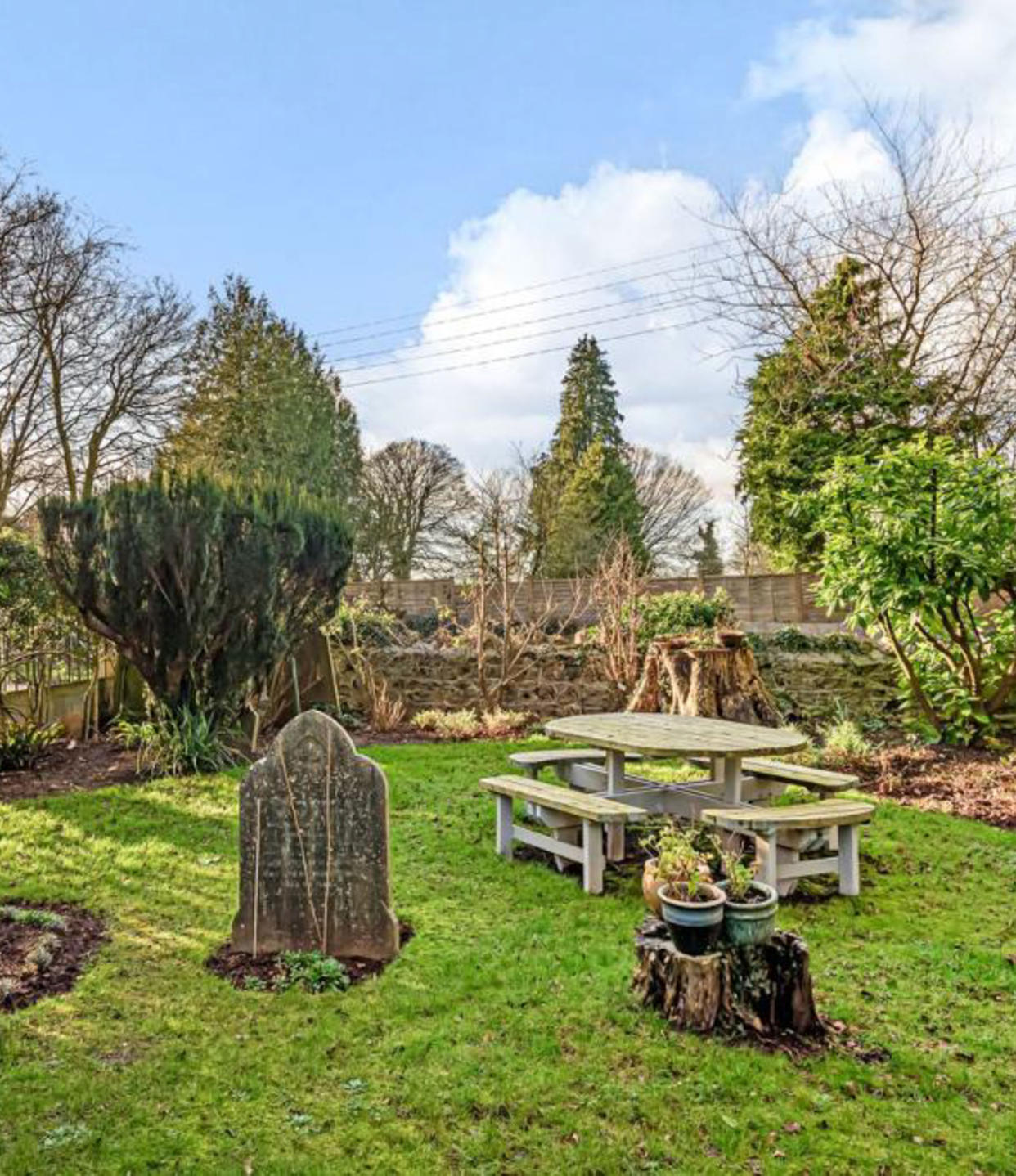 Prospective buyers will need to be ok with sharing their garden with gravestones. (Caters)