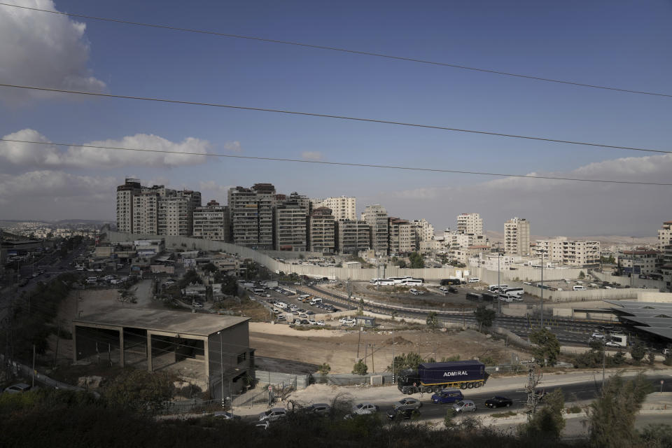 At the besieged Shuafat refugee camp in Jerusalem, Thursday, Oct. 13, 2022. It was the site of fierce clashes after Israeli security forces set up checkpoints that choked off the only exit and entry points of the camp during a manhunt following the death of a soldier, bringing life to a standstill for its estimated 60,000 residents. (AP Photo/Mahmoud Illean)