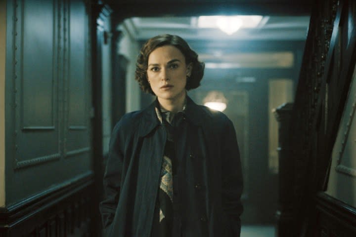 A woman stands in a hallway in Boston Strangler.