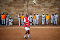 <p>A prisoner warms up before the start of a mock World Cup soccer match between Russia and Saudi Arabia as part of a monthlong soccer tournament involving eight prison teams at the Kamiti Maximum Security Prison near Nairobi, Kenya, on June 14, 2018. (Photo: Baz Ratner/Reuters) </p>