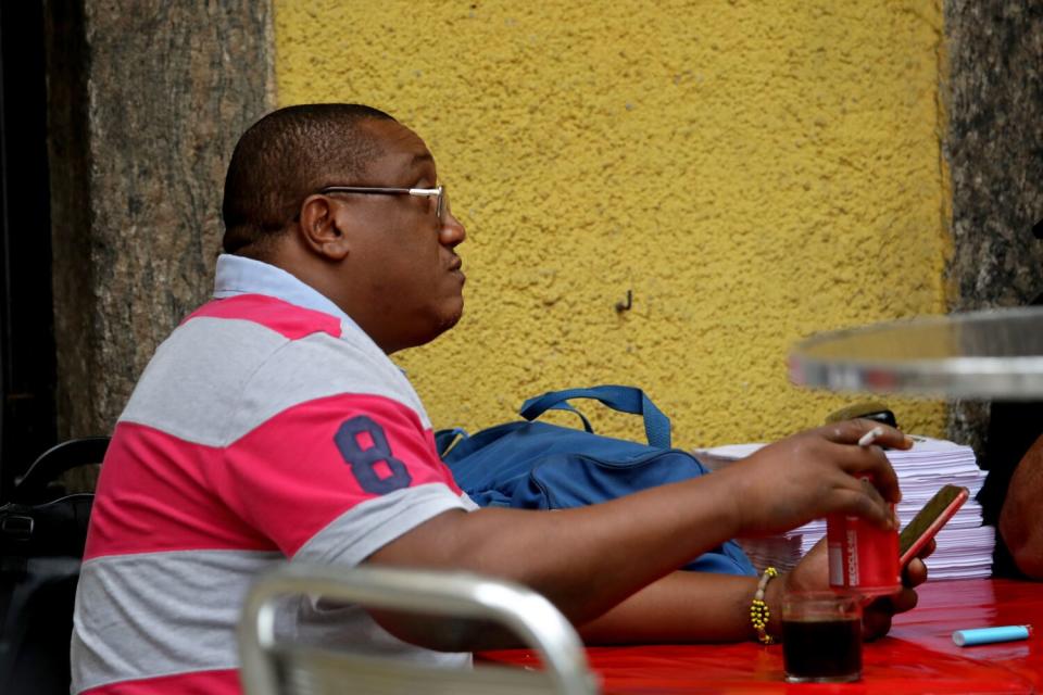 A man sits at a tabe.