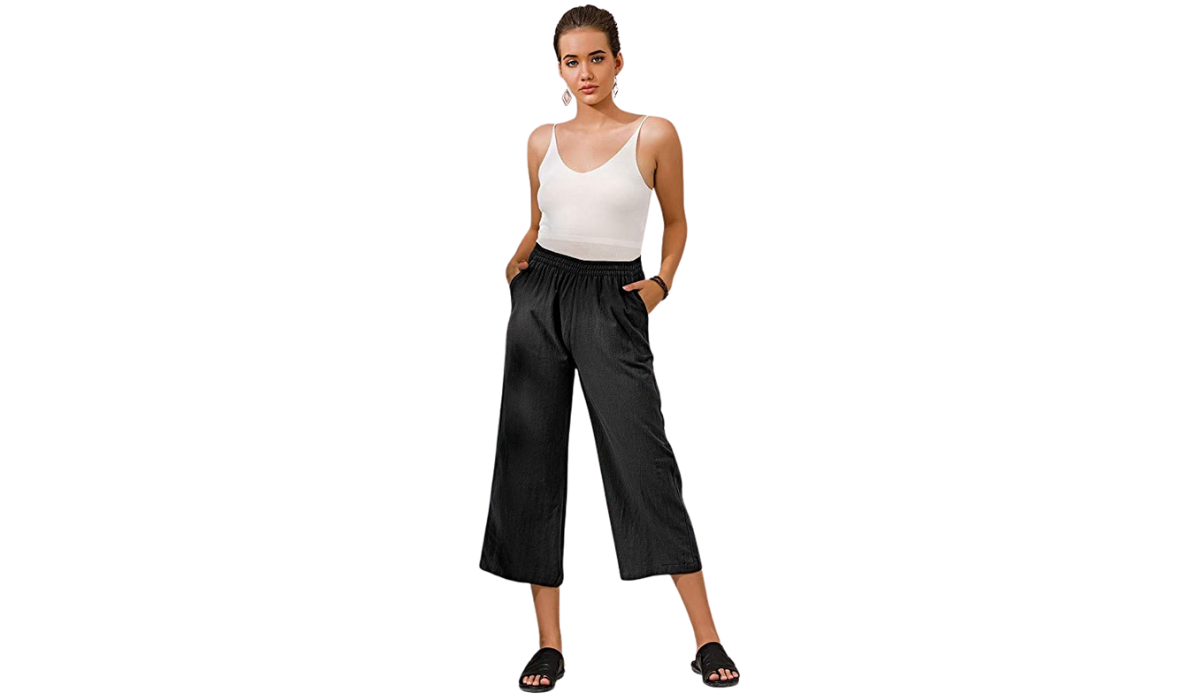 Model wearing black Ecupper wide legged linen pants and a tank top.