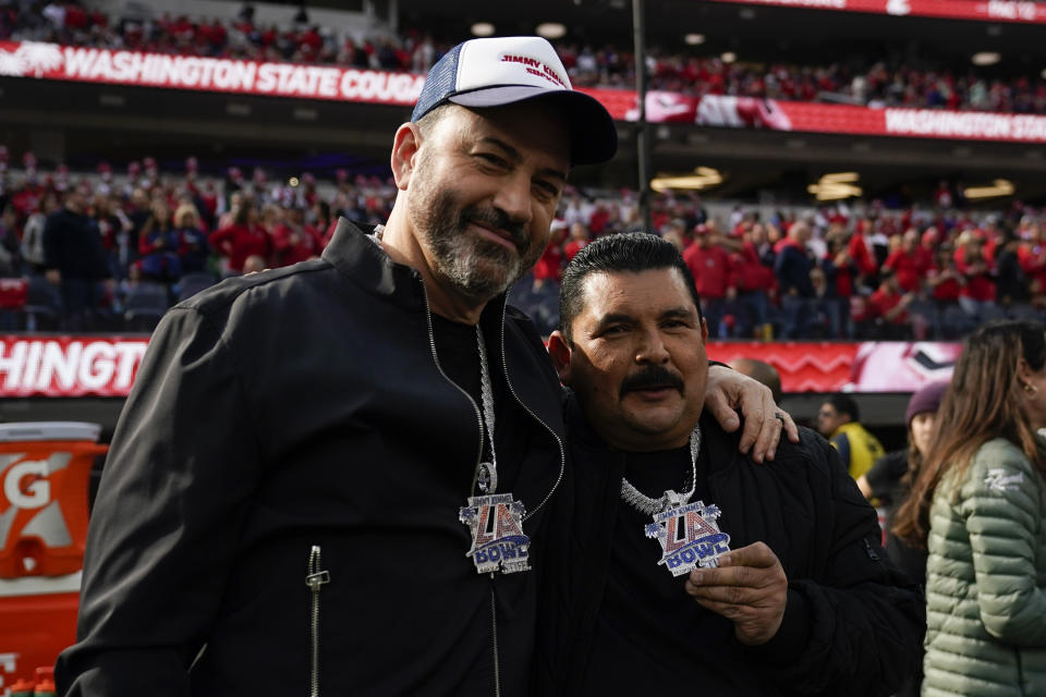 Jimmy Kimmel, left, and Guillermo Rodriguez pose for a photo before the LA Bowl between Fresno State and Washington State in Inglewood, Calif., Saturday, Dec. 17, 2022. (AP Photo/Ashley Landis)