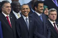 U.S. President Barack Obama (2nd L) stands among fellow world leaders as they pose for a family photo during the opening day of the World Climate Change Conference 2015 (COP21) at Le Bourget, near Paris, France, November 30, 2015. REUTERS/Ian Langsdon/Pool