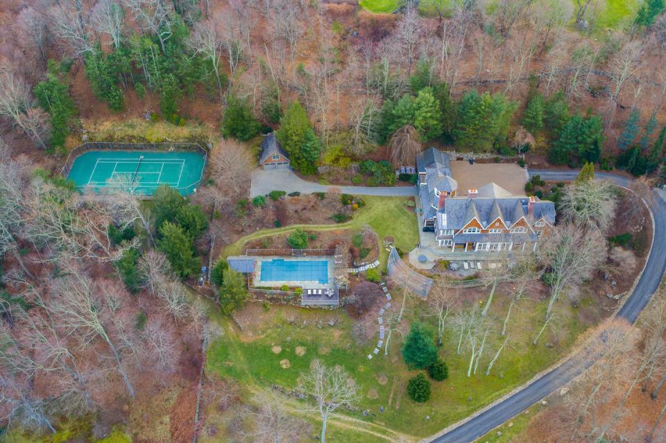 9) A saltwater pool and tennis court adorn the amazing yard.