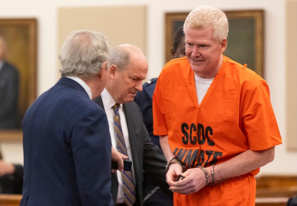 Alex Murdaugh talks with his attorneys Dick Harpootlian, left, and Jim Griffin during his sentencing (AP)