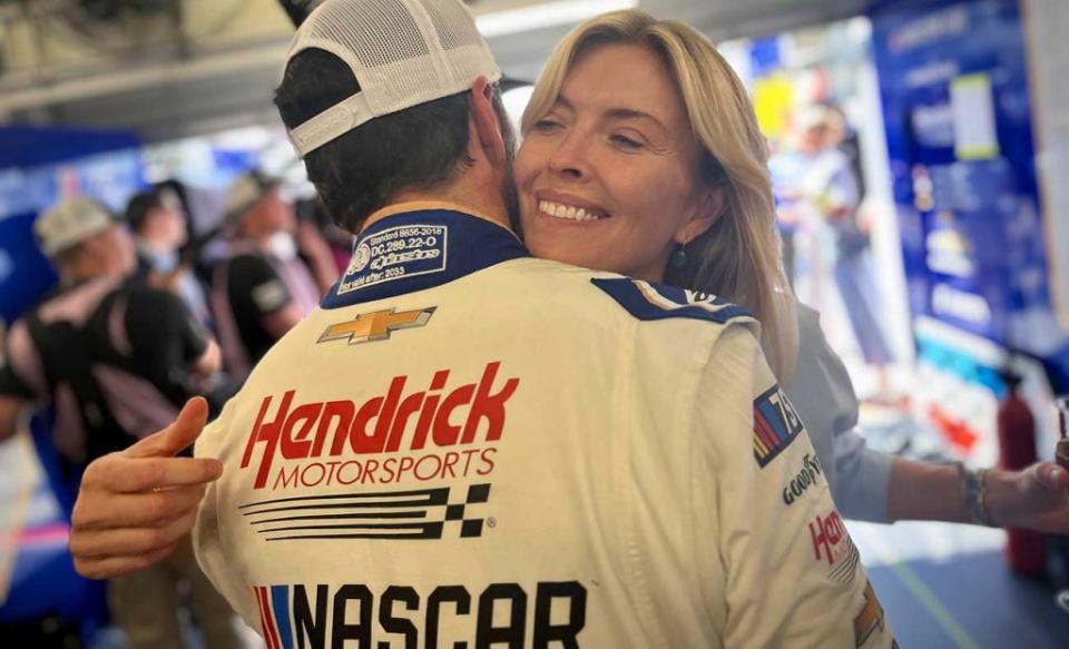 Jimmie Johnson and his wife, Chandra, embrace in the Garage 56 paddock at Le Mans