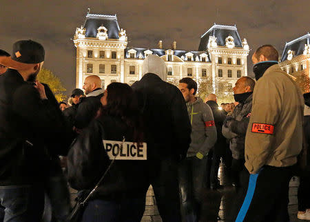 Police officers gather during an unauthorised protest against anti-police violence in front of the Police Prefecture in Paris, France, October 21, 2016. REUTERS/Jacky Naegelen