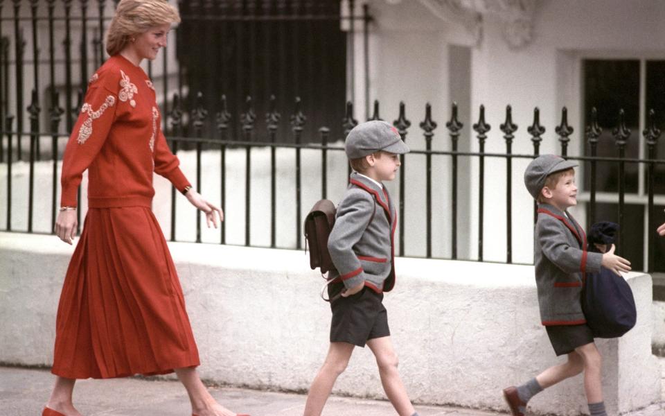 Diana, the Princess of Wales, follows her sons Prince Harry (right) and Prince William on Harry's first day at the Wetherby School in Notting Hill in September 1989 - Ron Bell/PA