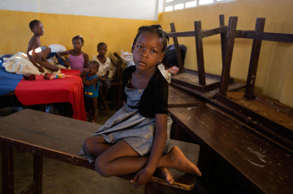 <p>A girl sits on a table in a shelter after Hurricane Matthew passed , in Jeremie, Haiti. Saturday Oct. 8, 2016. (AP Photo/Dieu Nalio Chery)</p>