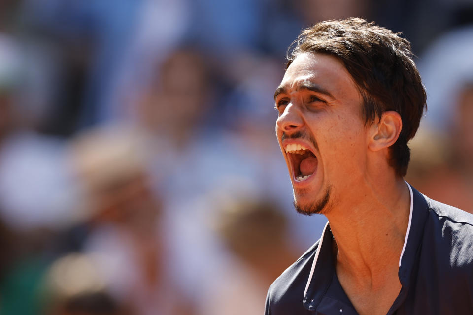 Italy's Lorenzo Sonego celebrates after beating Russia's Andrey Rublev during their third round match of the French Open tennis tournament at the Roland Garros stadium in Paris, Friday, June 2, 2023. (AP Photo/Jean-Francois Badias)