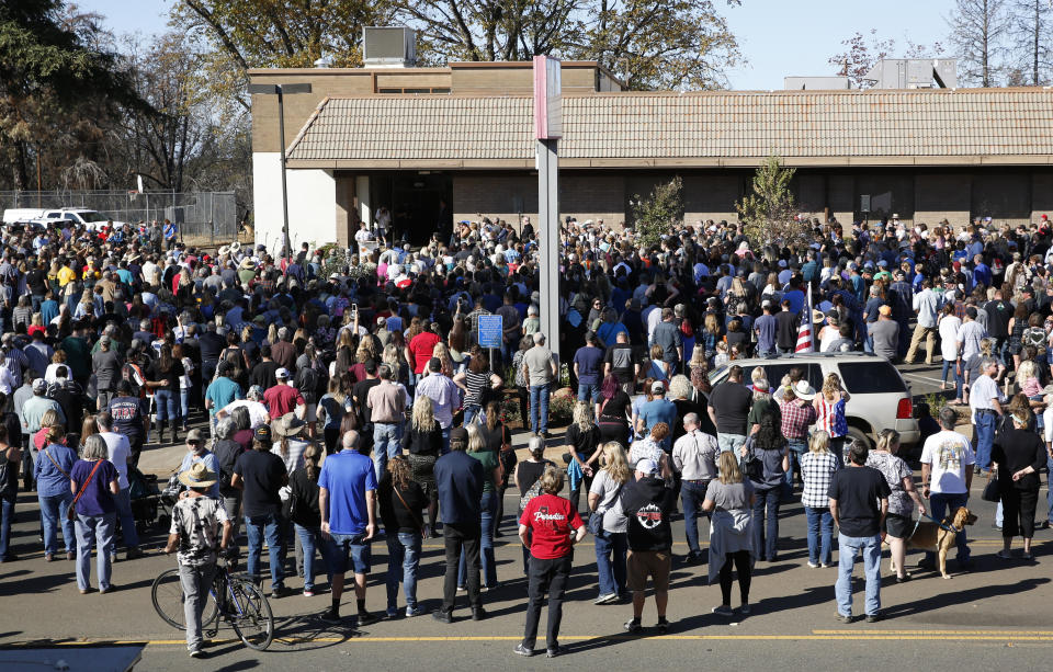 People gather for ceremonies for the one-year anniversary of the Camp Fire in Paradise, Calif., Friday, Nov. 8, 2019. There was 85 seconds of silence for the 85 people who died in last year's 8wildfire that nearly destroyed the entire town. (AP Photo/Rich Pedroncelli)
