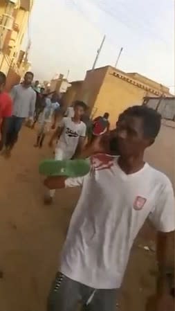 Protesters flee along side streets away from a sit-in, after security forces tried to disperse them, in central Khartoum, Sudan in this still frame taken from June 3, 2019 social media video