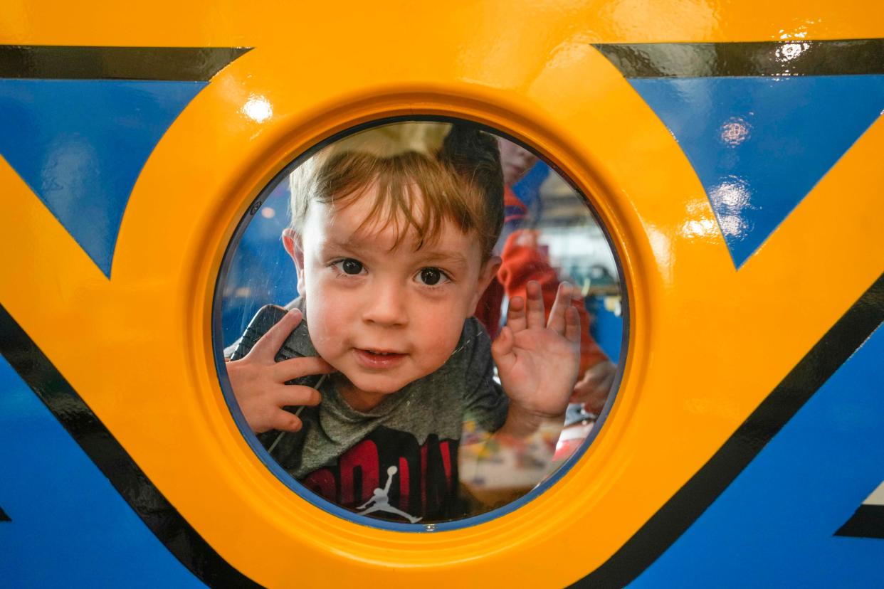 Josiah Crundman, 2, plays on one of his favorite exhibits, the Let's Play Railway, Wednesday, May 24, 2023, at Betty Brinn Children's Museum in Milwaukee.