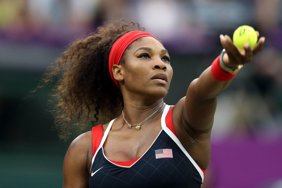 Serena Williams of the United States serves to Vera Zvonareva of Russia during the third round of Women's Singles Tennis on Day 5 of the London 2012 Olympic Games at Wimbledon on August 1, 2012 in London, England. (Getty Images)