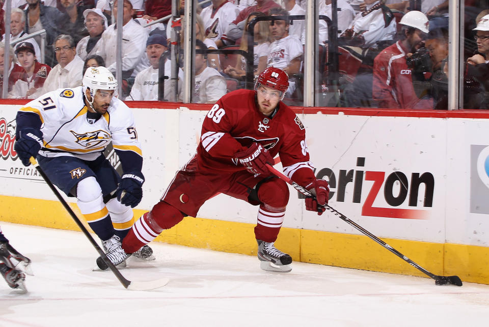 GLENDALE, AZ - MAY 07: Mikkel Boedker #89 of the Phoenix Coyotes skates with the puck past Francis Bouillon #51 of the Nashville Predators in the first period of Game Five of the Western Conference Semifinals during the 2012 NHL Stanley Cup Playoffs at Jobing.com Arena on May 7, 2012 in Glendale, Arizona. (Photo by Christian Petersen/Getty Images)