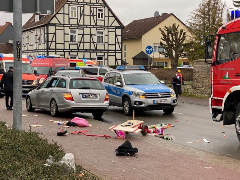 People react at the scene after a car ploughed into a carnival parade injuring several people in Volkmarsen