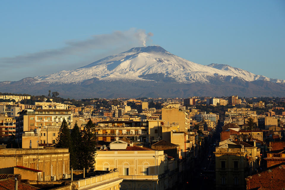 <p>Mount Etna is photographed from the Sicilian town of Catania, southern Italy, Feb. 16, 2017. (Photo: Marie-Laure Messana/AFP/Getty Images) </p>