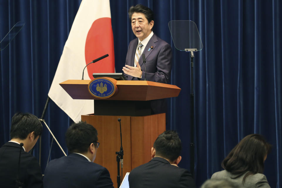 Japanese Prime Minister Shinzo Abe speaks during a press conference in Tokyo, Monday, Dec. 9, 2019. Abe said his country is arranging Iranian President Hassan Rouhani's visit to Japan as the country seeks to play a greater role in relieving tension in the Middle East where Japanese oil imports mainly come from. (AP Photo/Koji Sasahara)